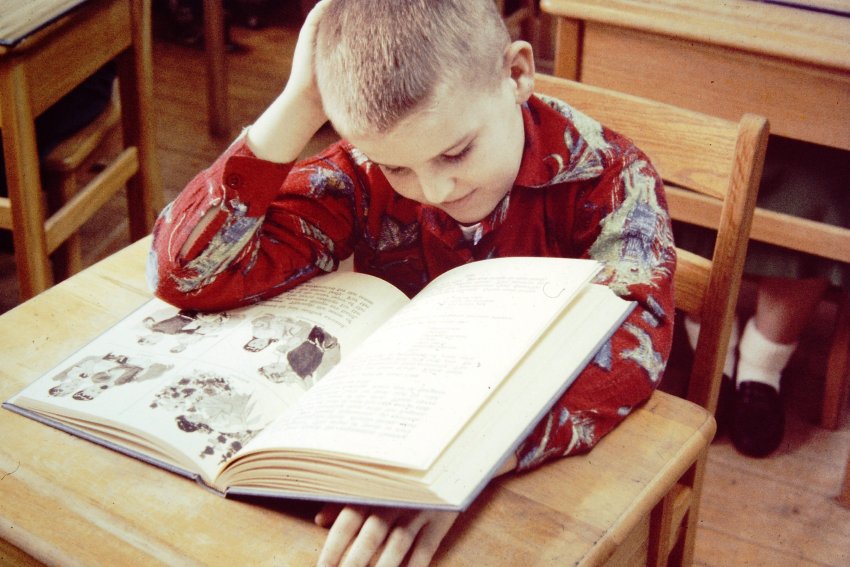 Boy with large type textbook-24