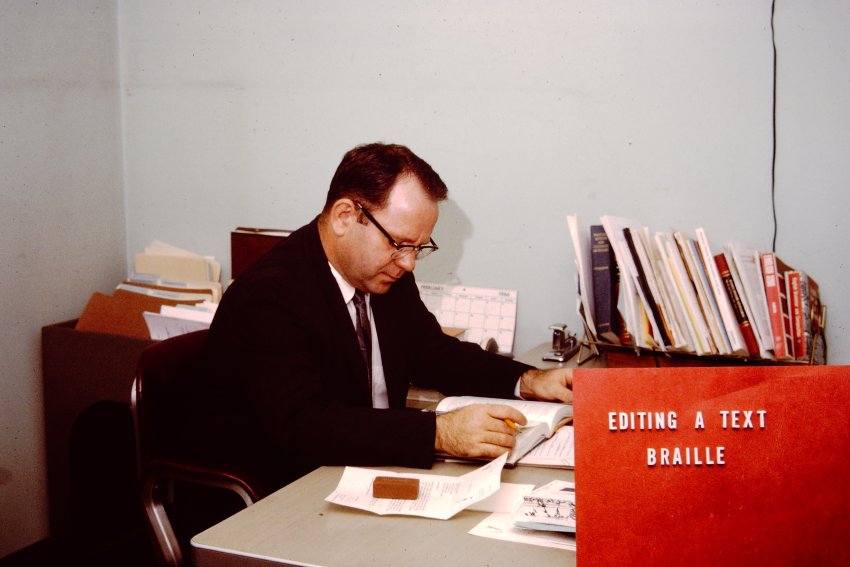 Ralph McCracken editing a braille textbook-93